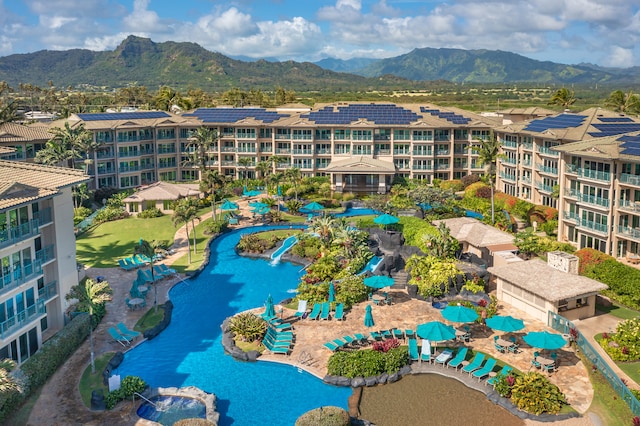 birds eye view of property featuring a mountain view