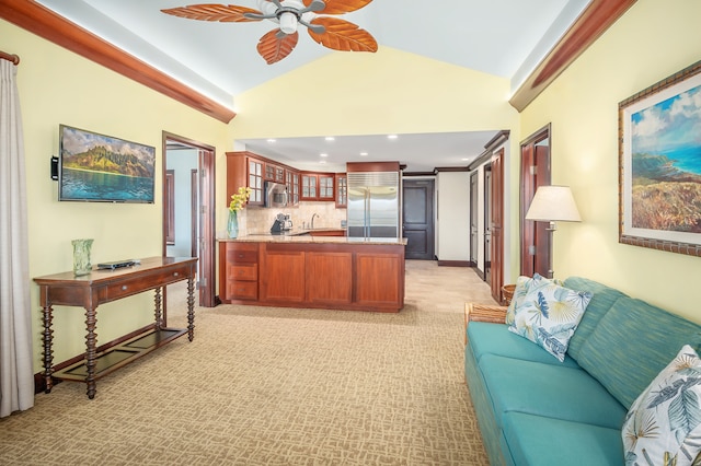 kitchen with kitchen peninsula, backsplash, ceiling fan, stainless steel built in fridge, and light carpet