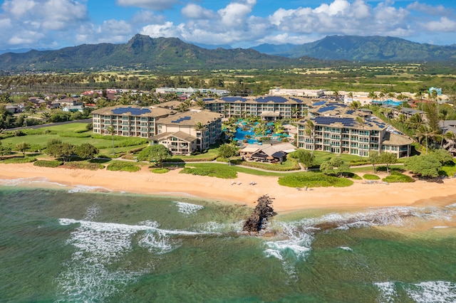 birds eye view of property with a beach view and a water and mountain view