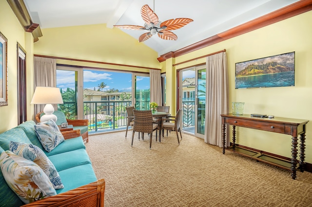 sitting room featuring lofted ceiling with beams, ceiling fan, and carpet