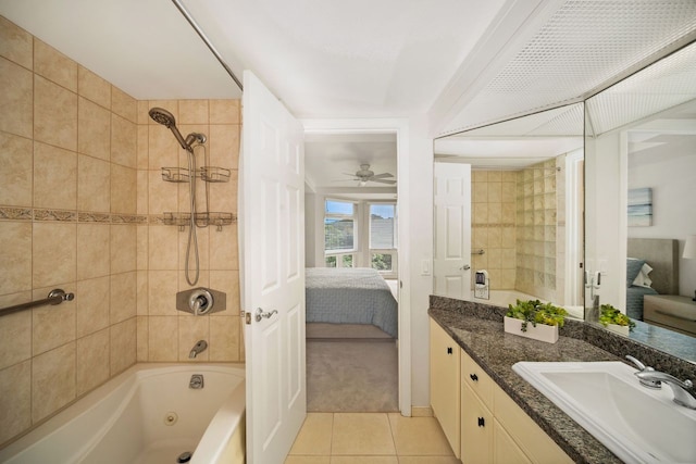 bathroom featuring tiled shower / bath combo, tile floors, ceiling fan, and large vanity