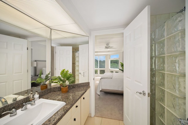 bathroom featuring ceiling fan, vanity, and tile flooring