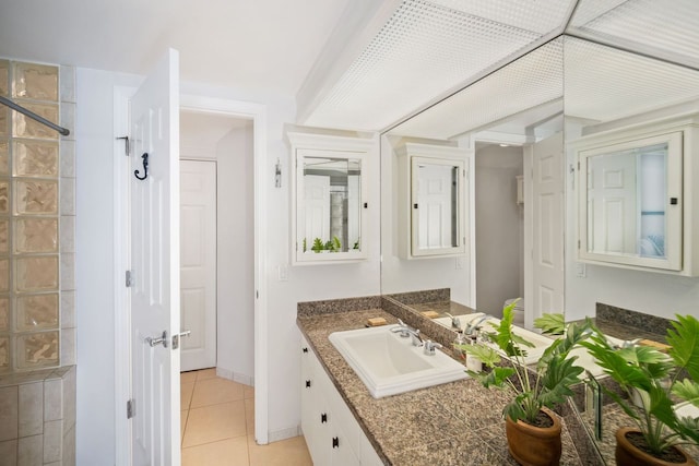 bathroom with tile floors and large vanity