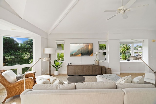 tiled living room with ceiling fan, a wealth of natural light, and lofted ceiling with beams