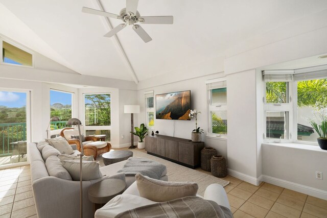 sunroom / solarium featuring vaulted ceiling, plenty of natural light, and ceiling fan