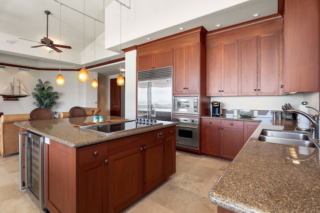 kitchen featuring sink, ceiling fan, light tile flooring, and built in appliances