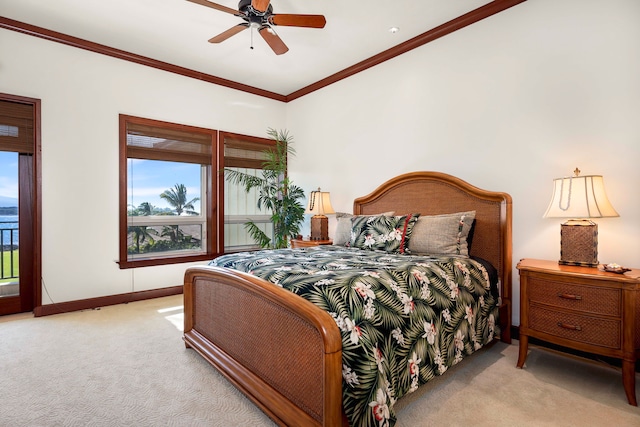 bedroom featuring ornamental molding, carpet flooring, and ceiling fan