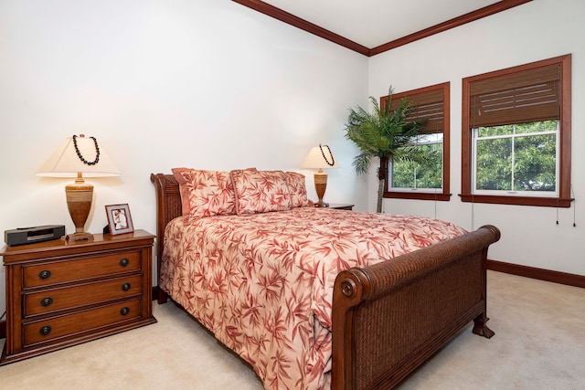 carpeted bedroom with ornamental molding