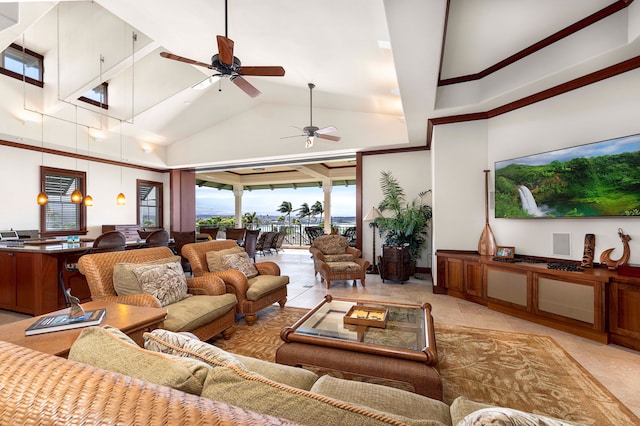 living room featuring ceiling fan, light tile floors, and a towering ceiling