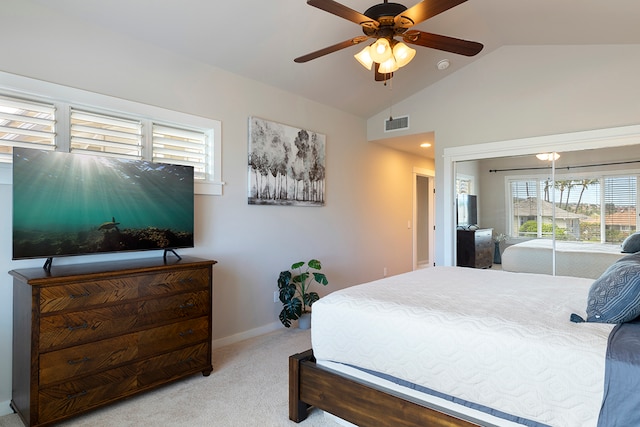 bedroom with carpet flooring, a closet, ceiling fan, and vaulted ceiling