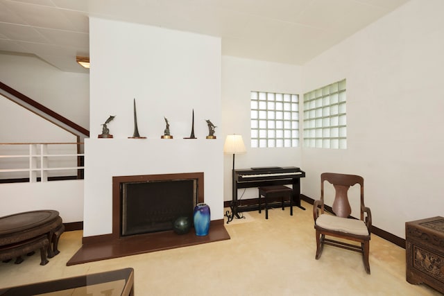 interior space featuring a fireplace and carpet floors