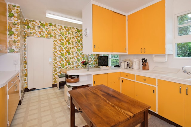 kitchen with sink and light tile flooring