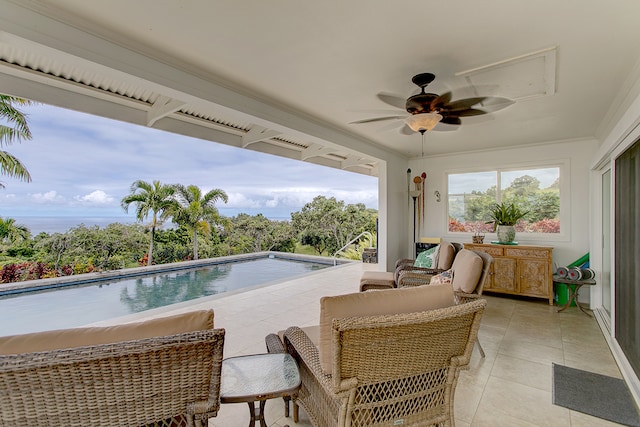 view of swimming pool with a patio, ceiling fan, and outdoor lounge area