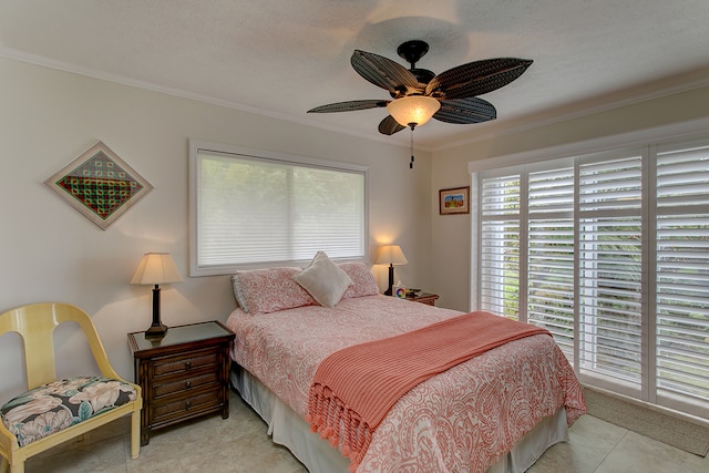 tiled bedroom with ceiling fan and ornamental molding