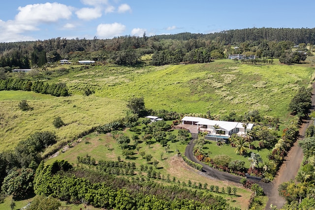 birds eye view of property with a rural view