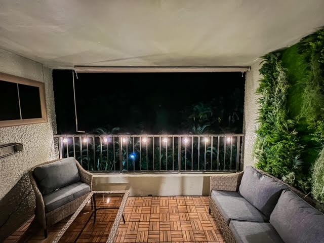 patio terrace at twilight featuring a balcony and an outdoor hangout area