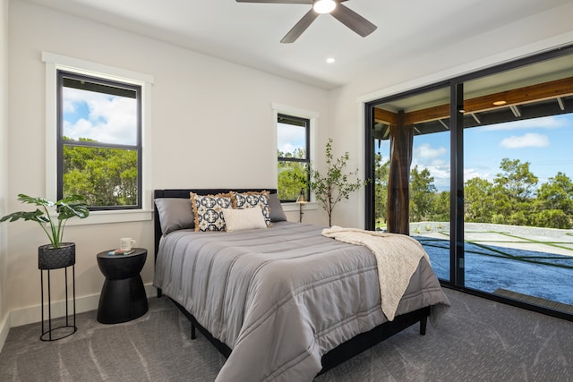 bedroom featuring carpet, ceiling fan, access to outside, and multiple windows