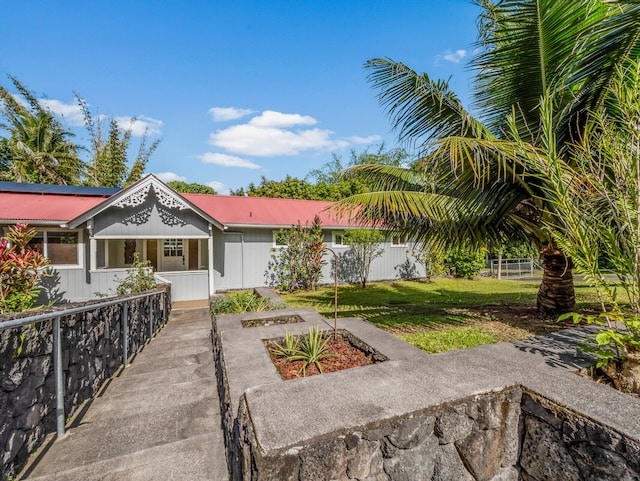 exterior space with a front lawn