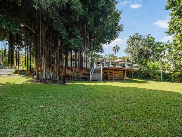 view of yard with a wooden deck