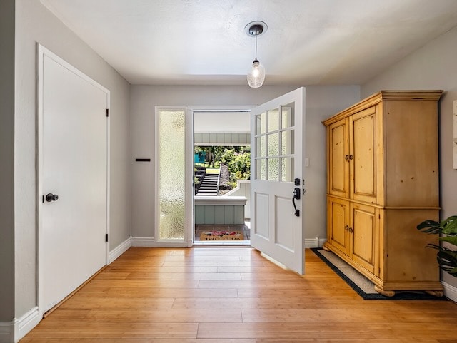 entryway with light hardwood / wood-style floors