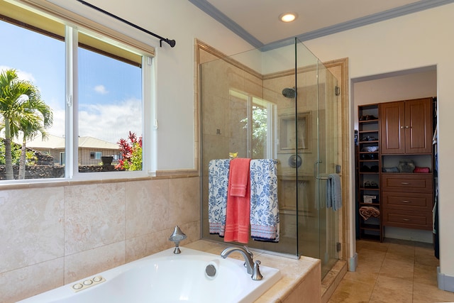 bathroom with ornamental molding, shower with separate bathtub, tile patterned floors, and plenty of natural light