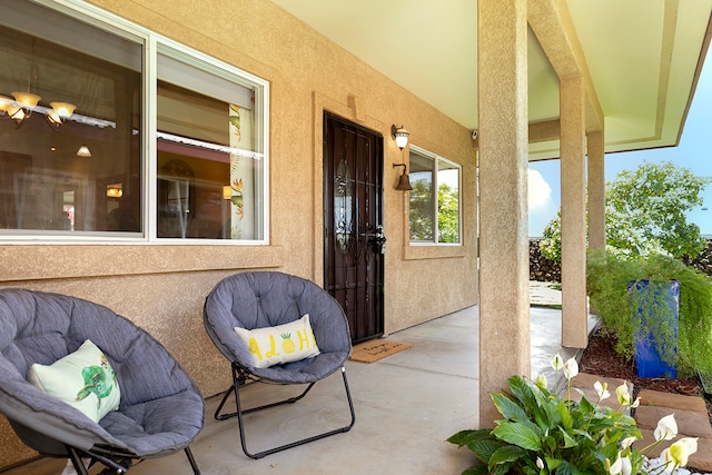 entrance to property with a patio area