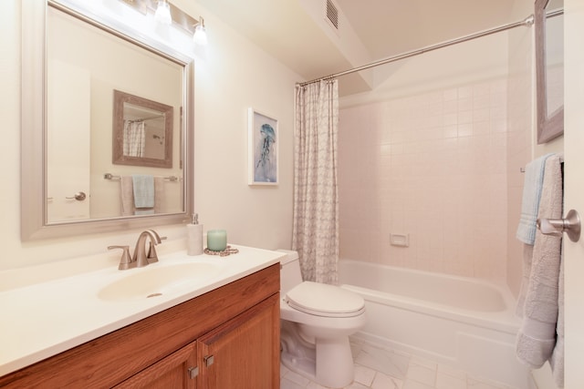 full bathroom with vanity, shower / tub combo, and toilet