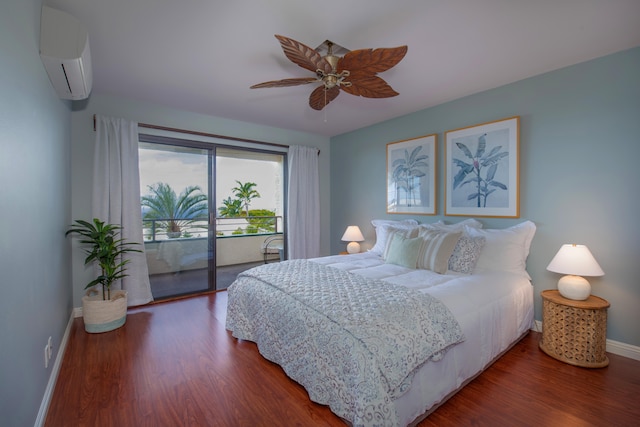 bedroom featuring hardwood / wood-style flooring, ceiling fan, a wall unit AC, and access to outside