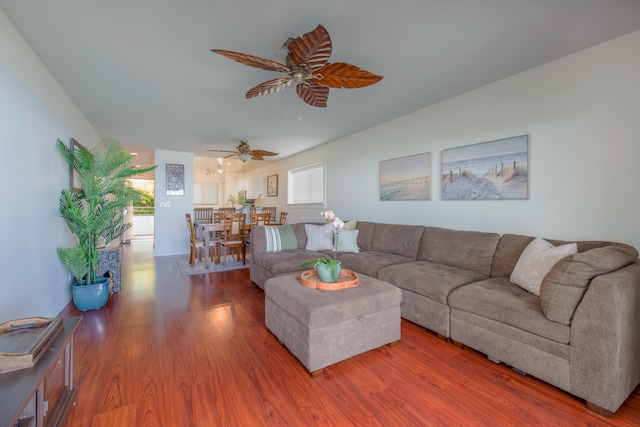 living room featuring hardwood / wood-style flooring and ceiling fan