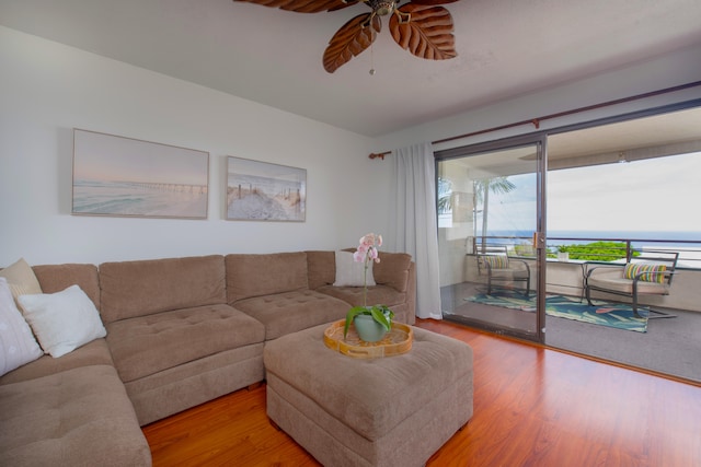 living room with ceiling fan and light wood-type flooring