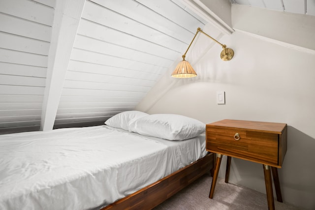 bedroom featuring dark colored carpet