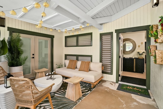 interior space with beam ceiling and french doors