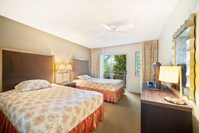 carpeted bedroom with a textured ceiling, access to exterior, and ceiling fan