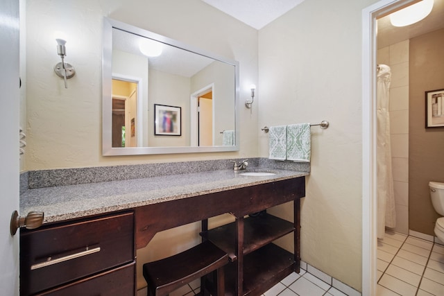 full bath with a shower with curtain, toilet, vanity, and tile patterned flooring