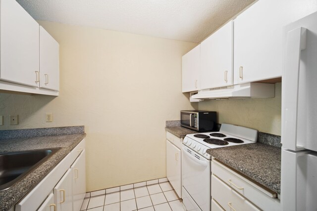 kitchen featuring white cabinetry, premium range hood, white appliances, sink, and light tile patterned floors