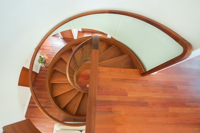 stairway with hardwood / wood-style flooring