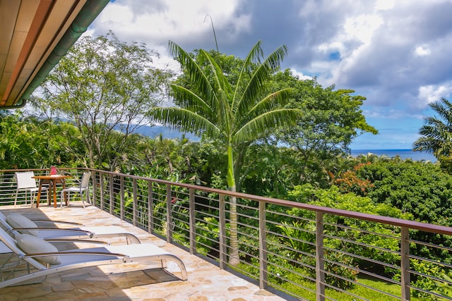 view of patio featuring a balcony