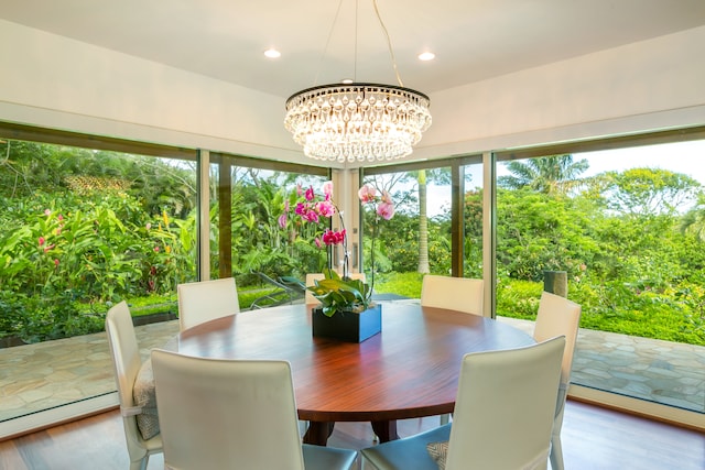 sunroom with a notable chandelier