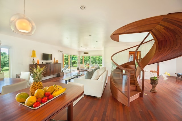 living room with a healthy amount of sunlight and hardwood / wood-style floors