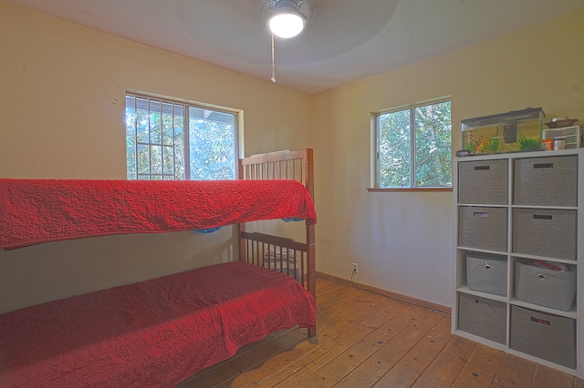 bedroom featuring ceiling fan and hardwood / wood-style flooring