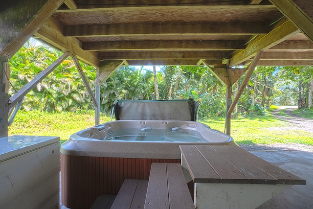 view of terrace with a hot tub