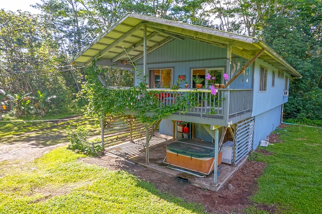 exterior space with a front yard and a deck