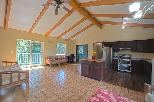 kitchen featuring appliances with stainless steel finishes, ceiling fan, light tile flooring, beam ceiling, and dark brown cabinetry