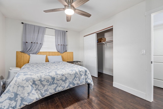 bedroom with ceiling fan, wood finished floors, a closet, and baseboards