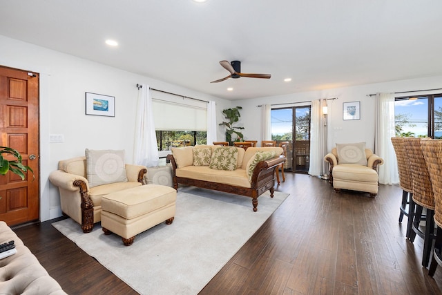 living room with plenty of natural light, recessed lighting, dark wood-type flooring, and ceiling fan