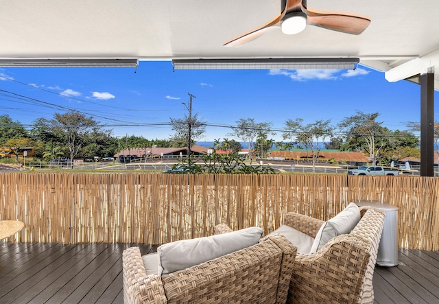 wooden terrace featuring ceiling fan