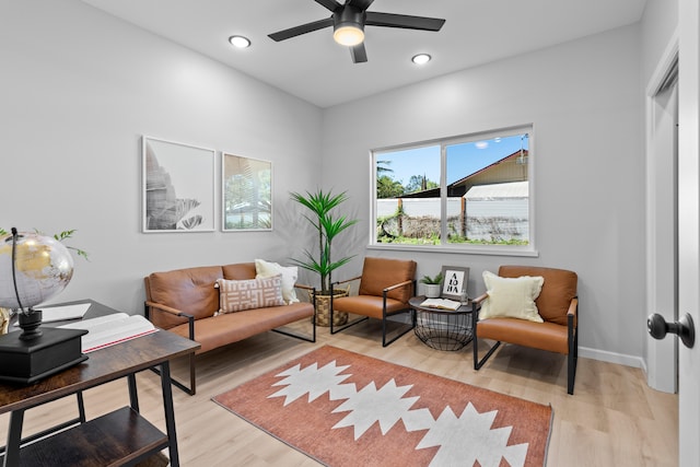 sitting room featuring ceiling fan and light hardwood / wood-style floors