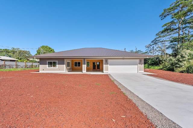 view of front of house featuring covered porch and a garage