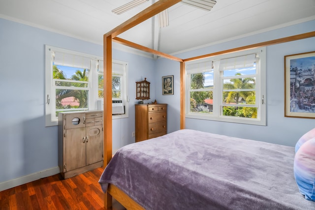 bedroom featuring dark wood-type flooring and crown molding