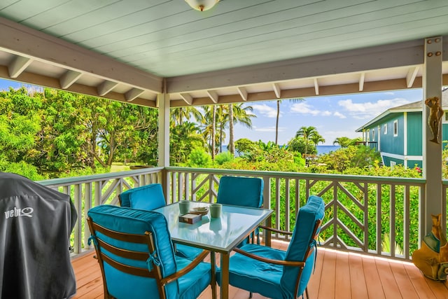 wooden terrace featuring area for grilling